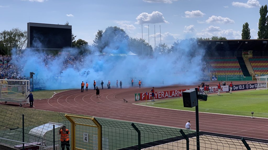 Bochum supporters make smoke during the Pokal match against Viktoria Berlin in July 2022.