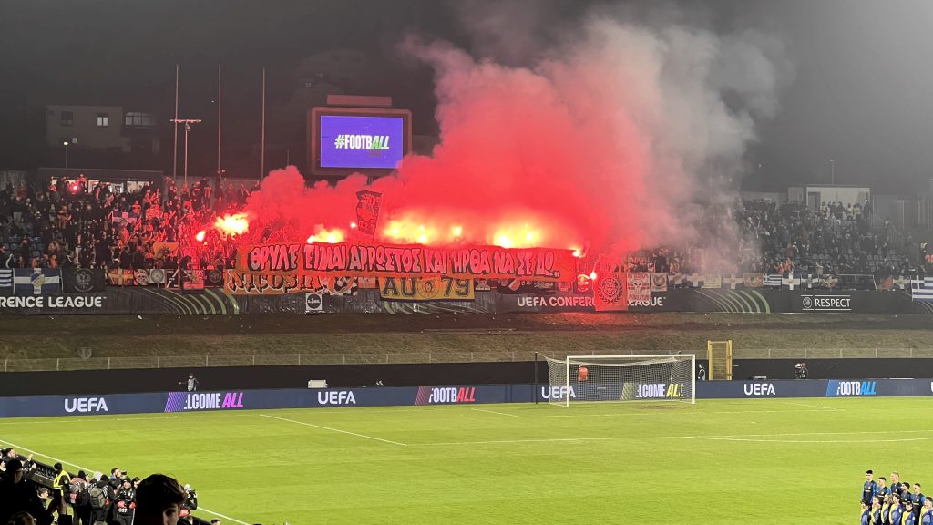 APOEL away fans light flares in Celje.