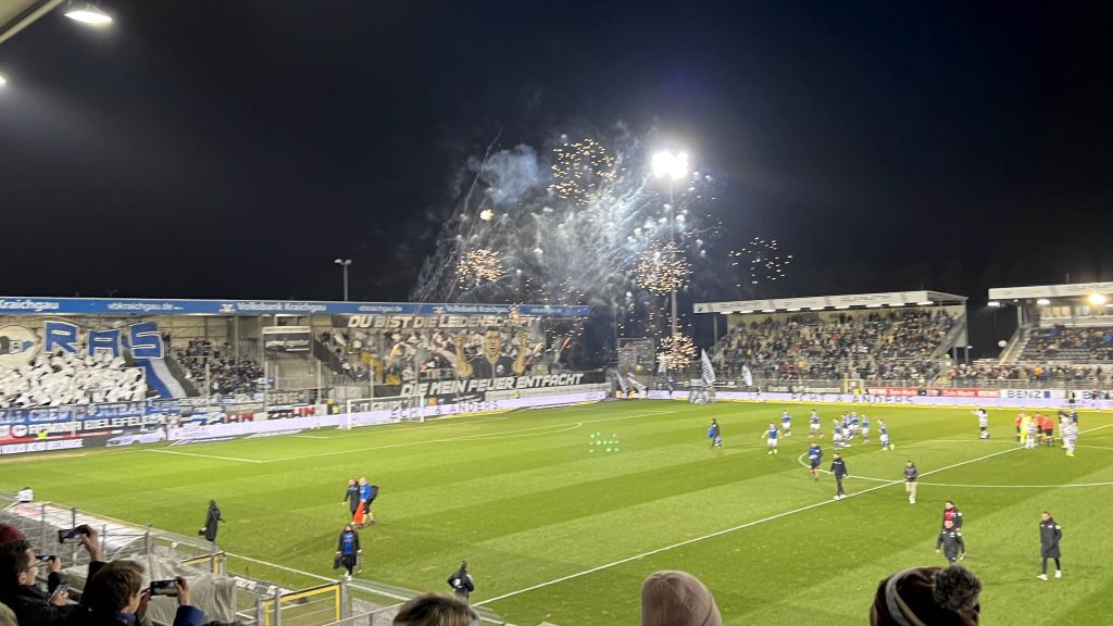 SV Sandhausen ultras set off fireworks before their teams home match with Arminia Bielefeld.